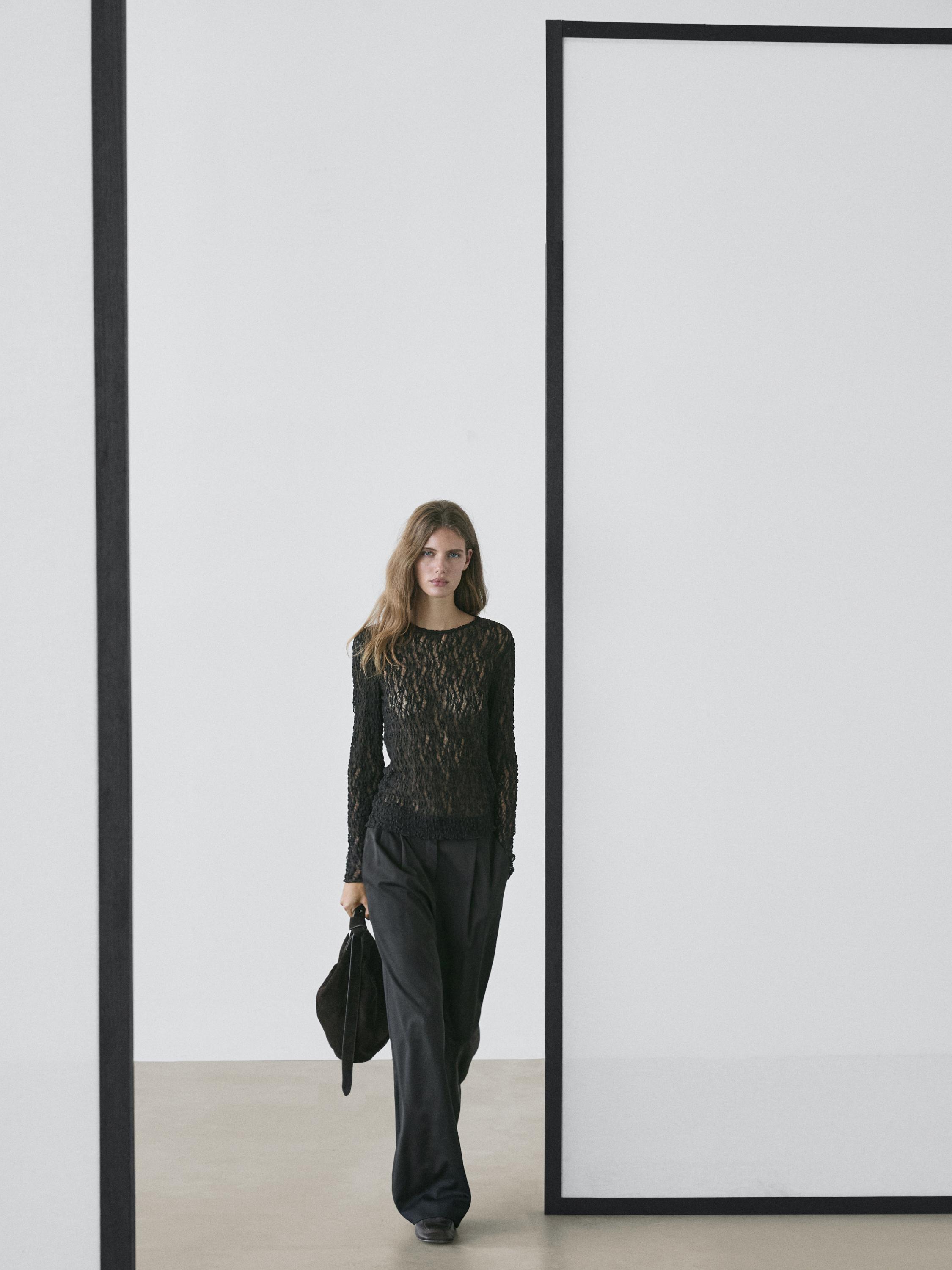 Openwork knit top with long sleeves and lace